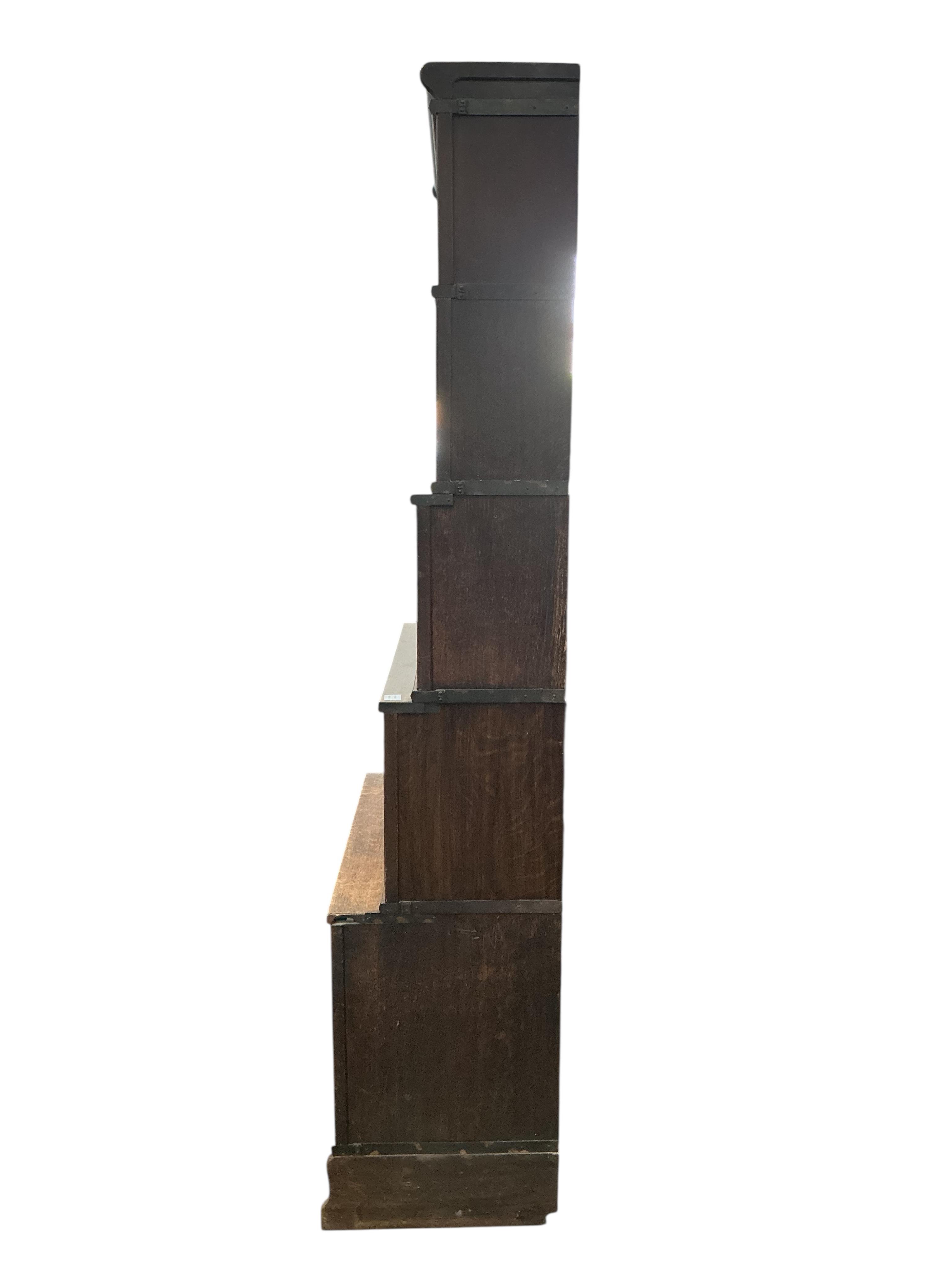 A Globe Wernicke oak five section bookcase, two sections missing glass panels, width 86cm, depth 46cm, height 220cm